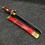 55cm Roronoa Zoro Sandai Kitetsu wooden tanto with deep red scabbard and cross-like guard, One Piece anime replica.
