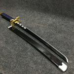 85cm Muichiro Tokito wooden wakizashi with black blade, golden rectangular guard, and teal-wrapped hilt.