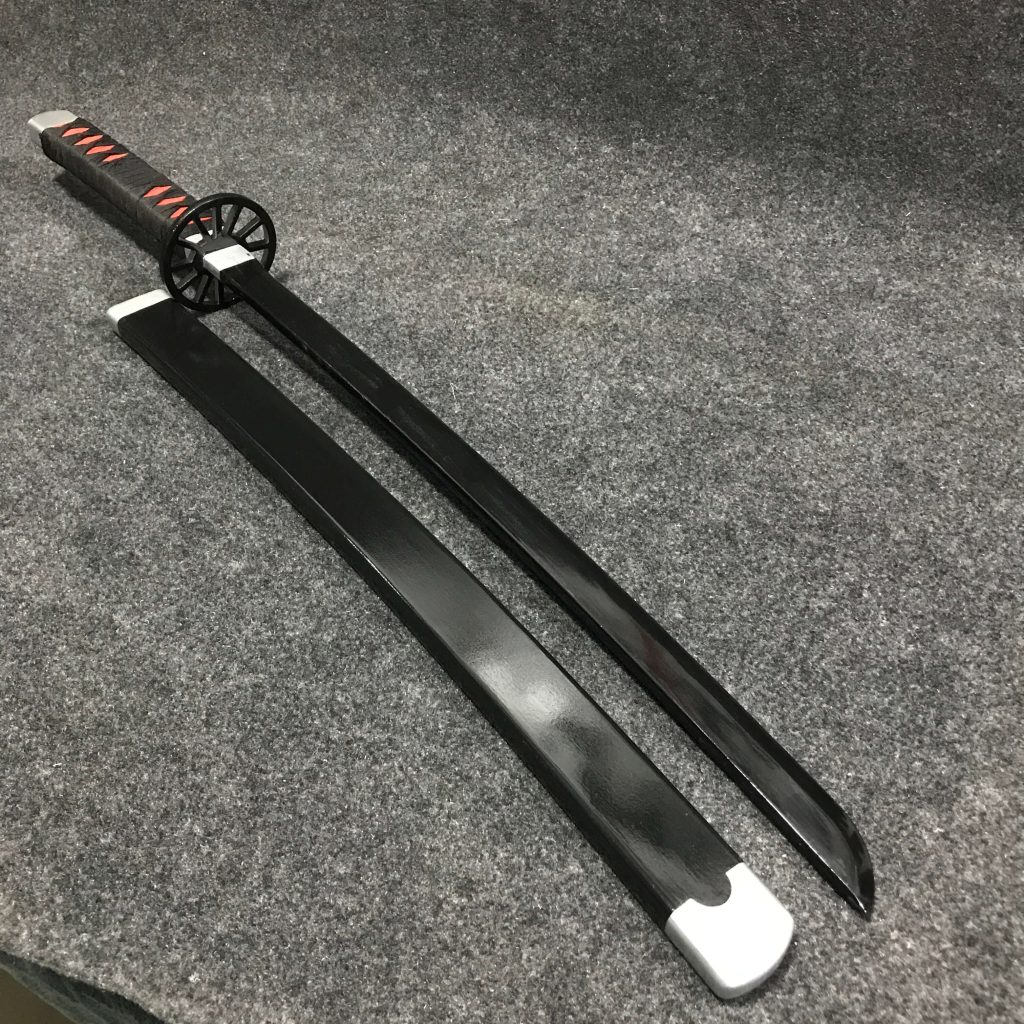 85cm Tanjiro Kamado wooden wakizashi with black blade, signature cartwheel guard, and black-and-red wrapped hilt.