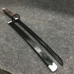 85cm Tanjiro Kamado wooden wakizashi with black blade, signature cartwheel guard, and black-and-red wrapped hilt.