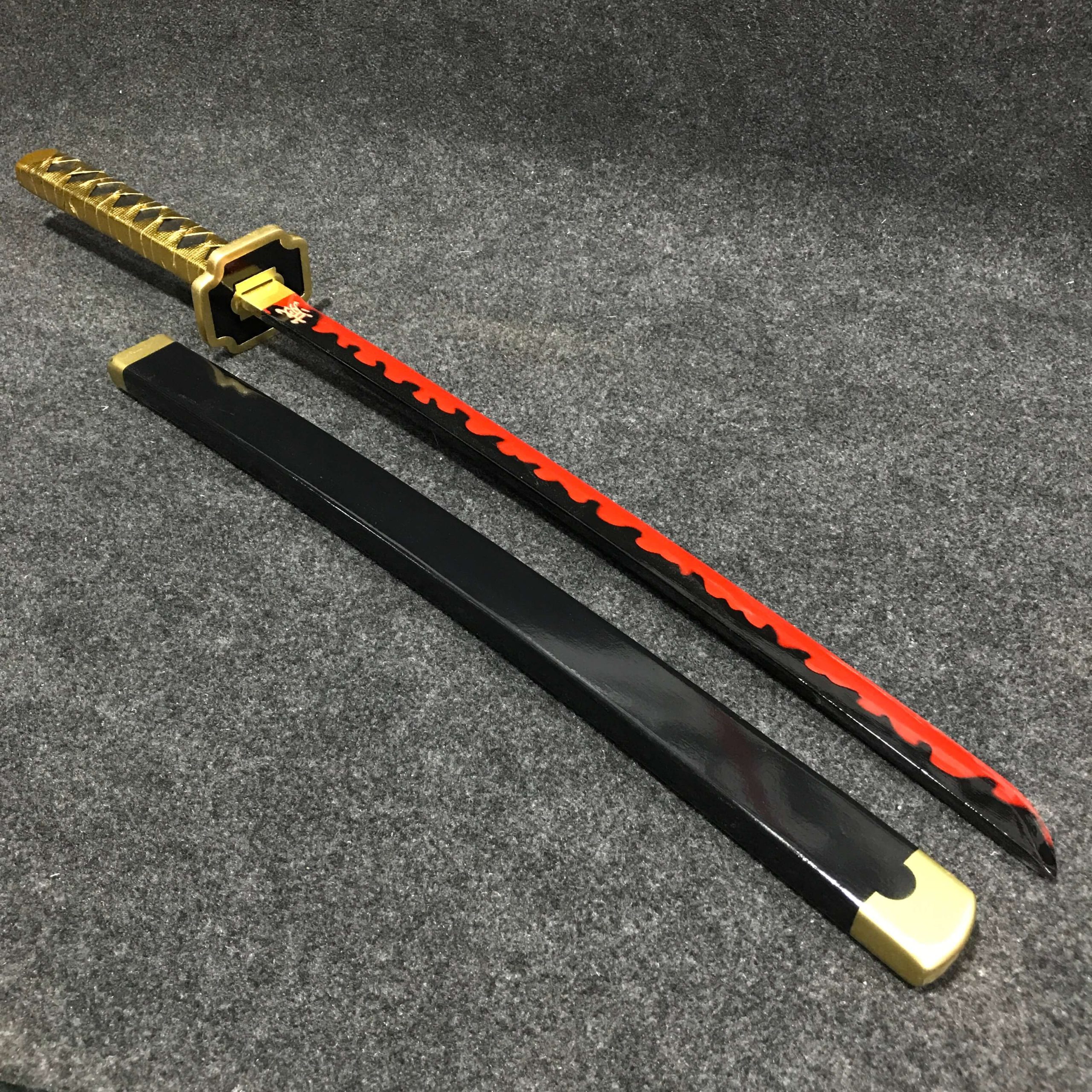 you w2 85cm Yoriichi Tsugikuni wooden wakizashi with black blade, circular gold sun guard, and black-and-gold wrapped hilt.